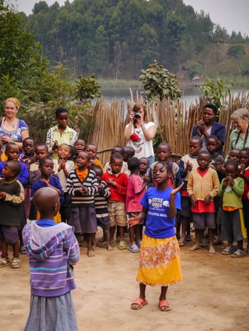 Little girl leading the school in song and dance