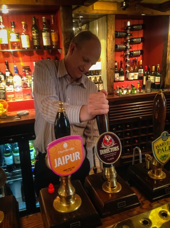 A barman pulling us a pint of Directors