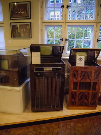 Antique televisions. They're vertical with a mirror because the cathode ray tube was so long.