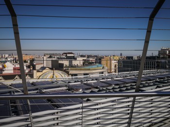 Looking out from the rooftop, straight at a hotel pool