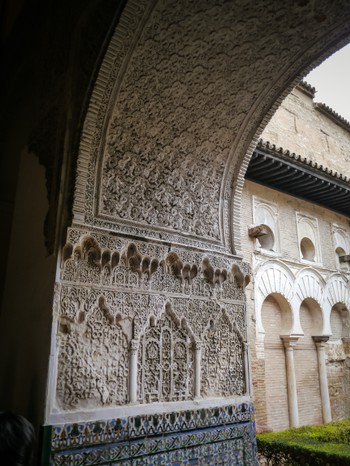 Intricate carved archway in the Alcázar of Seville